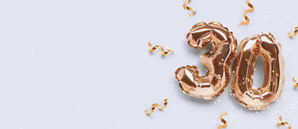 istock Banner with number 30 gold colored inflatable balloons. 1770540666