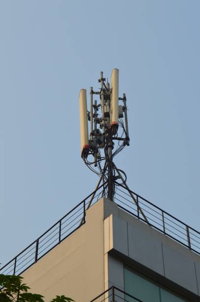 istock selective focus, Base Transceiver Station ( BTS ) tower against blue sky background at daytime. 1770543973