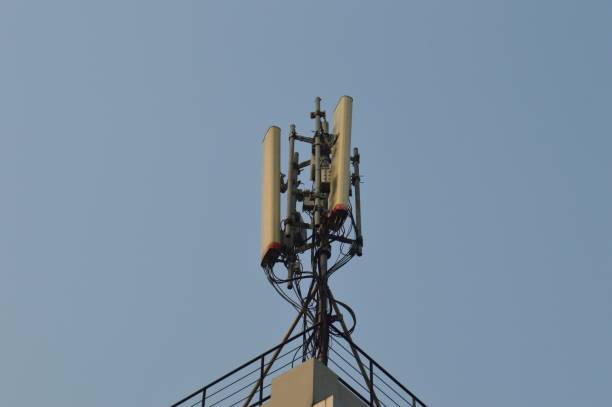 istock selective focus, Base Transceiver Station ( BTS ) tower against blue sky background at daytime. 1770544016