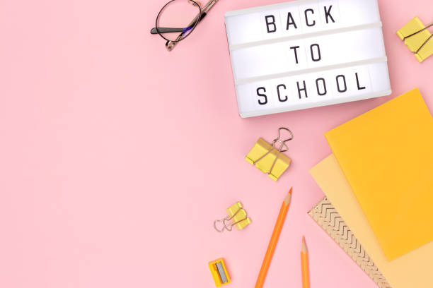 istock Back to school. Lightbox with letters and stationery on a pink background. 1770558001