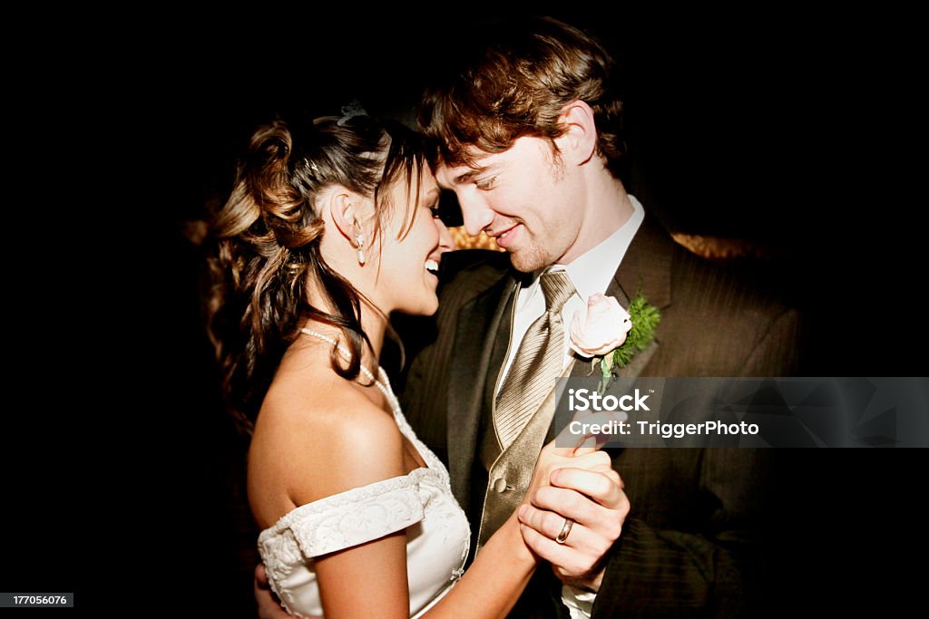 Attractive Bride and Groom Happy Wedding Couple Dancing beautiful dancing into the night. Wedding Stock Photo