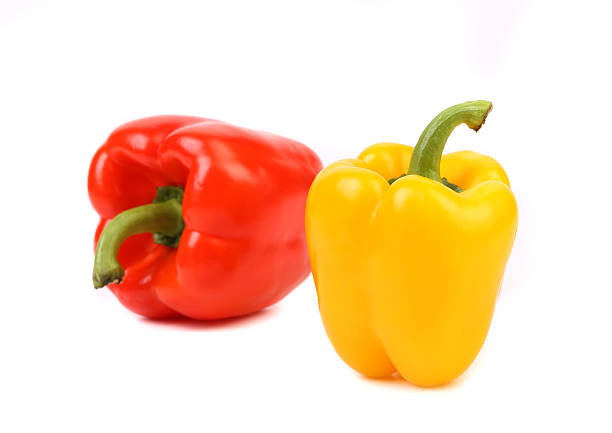 istock Red and yellow peppers with tails. 177058190