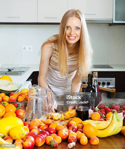 Cheerful Housewife Making Cocktail Stock Photo - Download Image Now - Adult, Adults Only, Alcohol - Drink