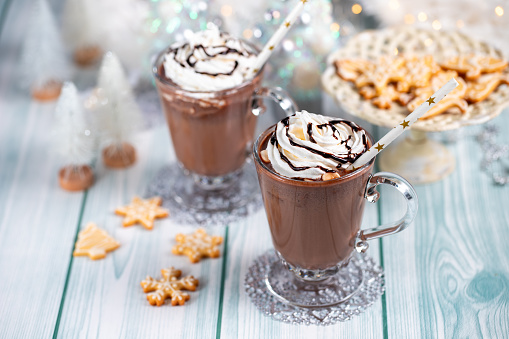 Hot chocolate or coffee with whipped cream, winter holidays treats concept