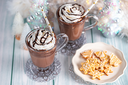 Hot chocolate or coffee with whipped cream, winter holidays treats concept