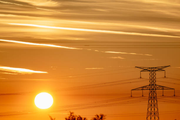 istock Sunrise with an electricity pylon and nature 1770584282