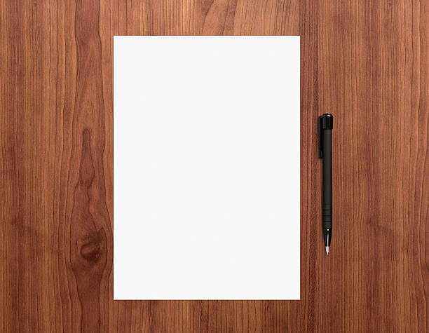 istock Blank paper with pen on desk 177058439