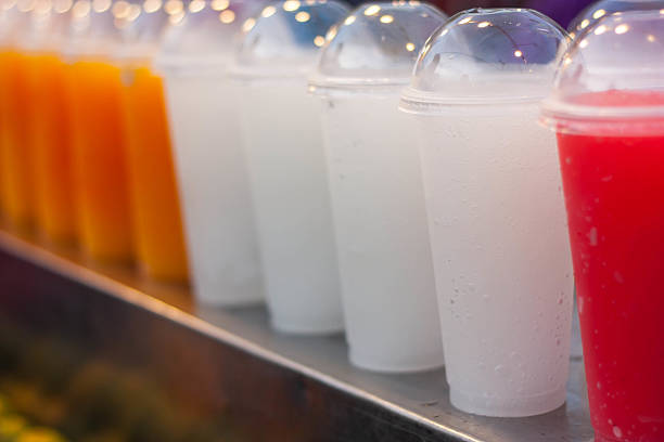 istock Colorful smoothy fruit juice in plastic glass 177059238