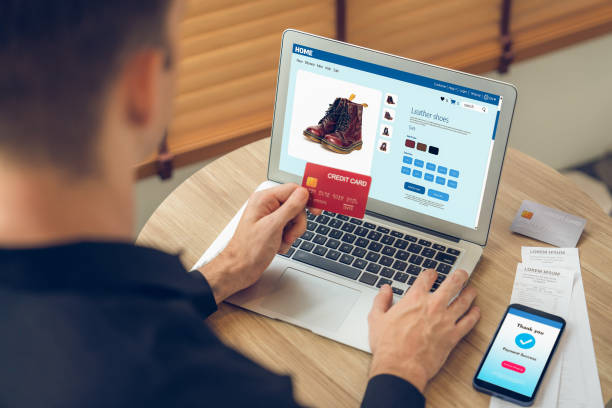 istock Young man using laptop with credit card for internet banking. Unveiling 1770601022