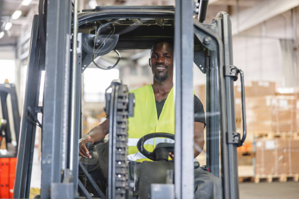istock African American Airport Warehouse Worker Driving A Forklift 1770615591