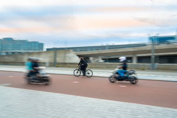 istock Moving bicyclist and motorcyclist on a blurry background 1770618425