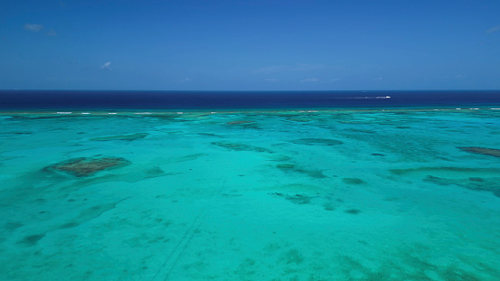 The lagoon and reef are contrasting colours of turquoise