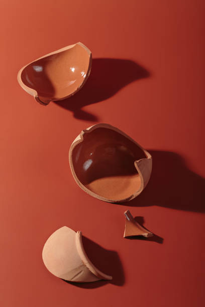 istock Details of broken ceramic cup on red background 1770659151