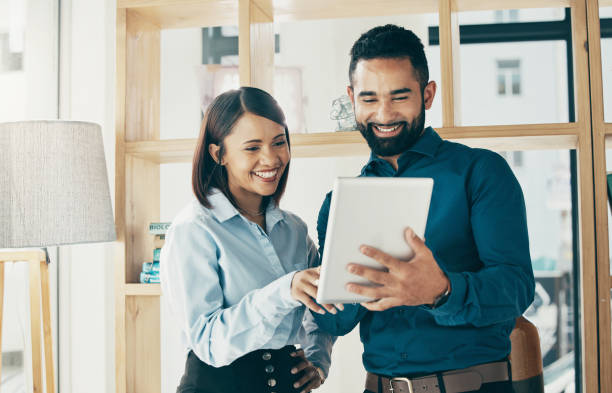 istock Business people, smile and tablet for digital marketing, communication, networking or project management in office. Professional. man and woman with touchscreen for meeting or planning at workplace 1770662807