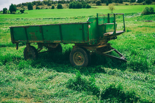 istock Green and old trailer abandoned in a green field 1770665809