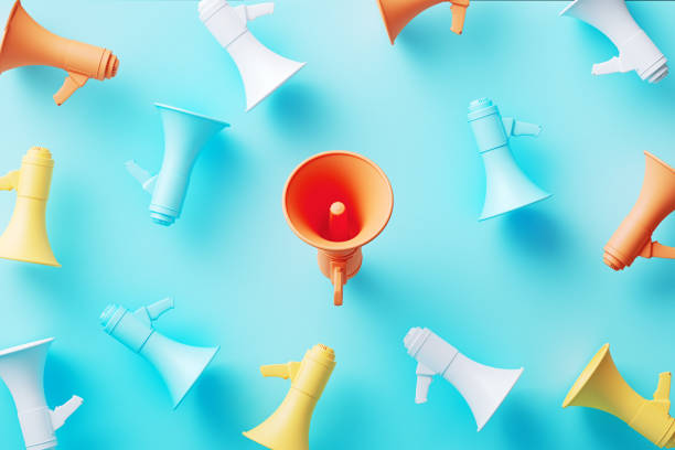 Orange Megaphone Surrounded By Colorful Megaphones  On Blue Background