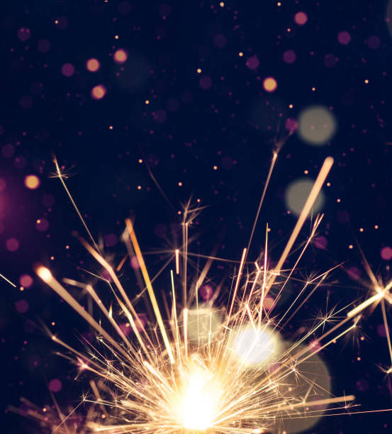 istock Burning sparkler with  bokeh light on blue background. 1770678380
