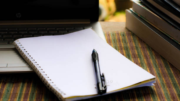 istock books, pens and laptop on the table 1770682567