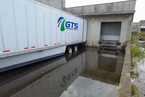 Jersey City, New Jersey, USA-07.07.2023: Downpours flooded the warehouse. Truck in the water