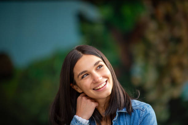 istock Close up smiling young woman thinking 1770684811