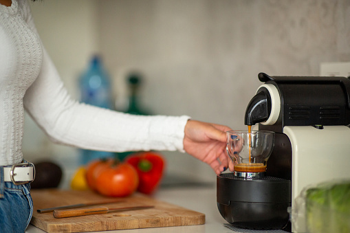 hand making coffee with coffeemaker