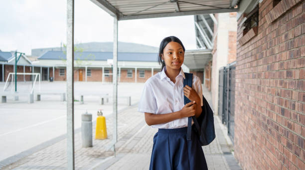 istock Schoolgirl walking to her class in school 1770687013