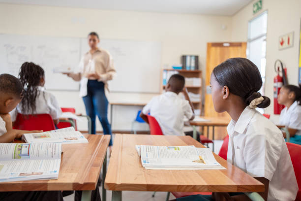istock Attentive students with teacher in the school classroom 1770689236