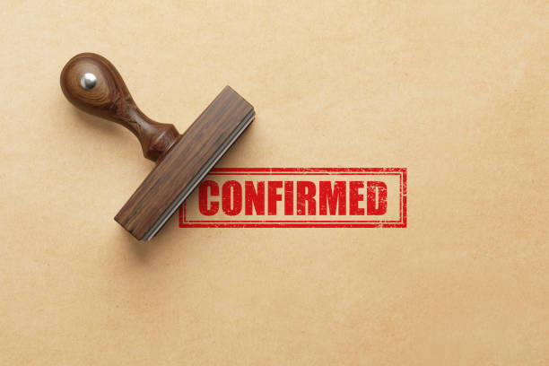 istock Confirmed Stamp On Kraft Paper Background 1770689238