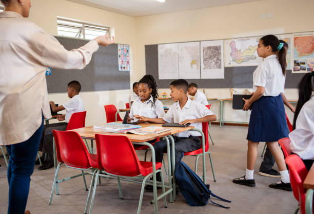 istock Students arriving and settling on their desks before the lecture in classroom 1770689252