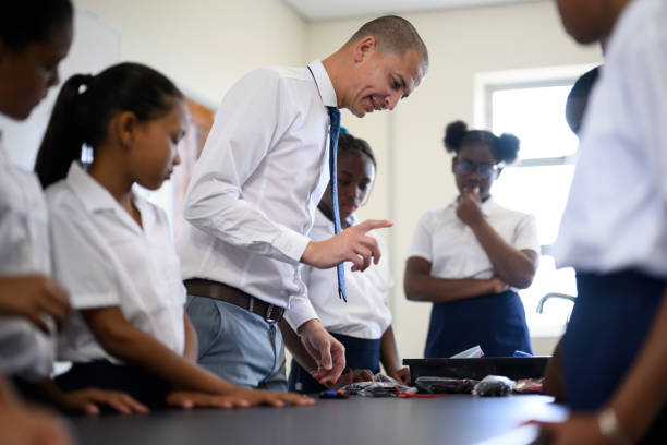 istock Teacher explaining to school children about electricity in science class 1770691008