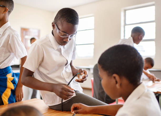 istock Group of schoolboys learning about electricity in science class 1770704074