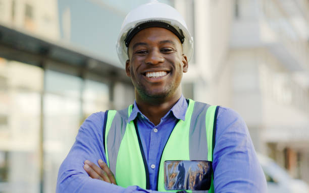 istock Black man, portrait and construction worker arms crossed, architect or contractor smile with pride. Architecture, infrastructure with urban development and professional engineer outdoor at job site 1770706183