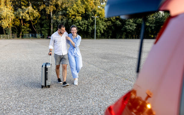 Young couple loads suitcases, craving new experiences