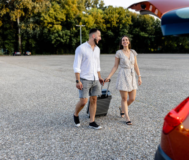 istock Young couple loads suitcases, ready to explore 1770720553