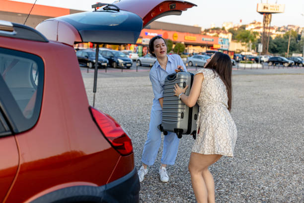 istock Two friends load suitcases, ready for precious memories 1770727667