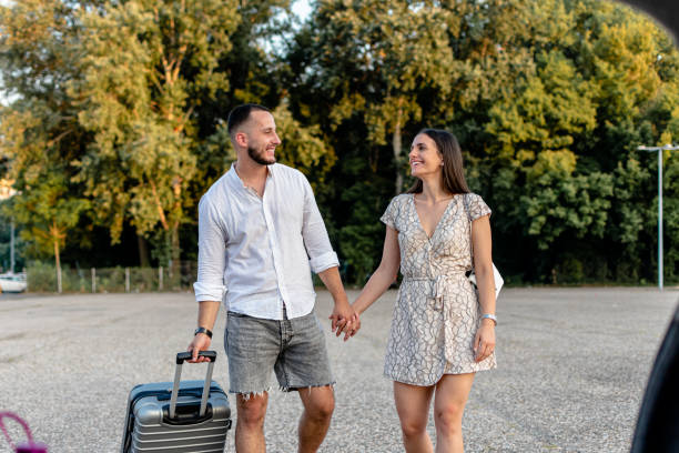istock Young duo brings suitcases, ready for a private retreat 1770729355