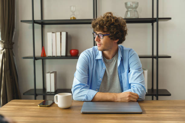 istock Young  businessman or freelance working and use a computer laptop and thinking idea for her business 1770738882