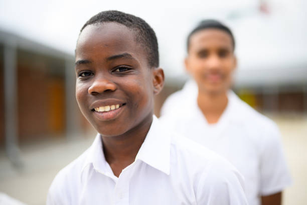 Candid portraits schoolchildren standing inline outside