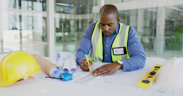 istock Black man, architecture and drawing blueprint for construction job, engineer and design with developer. Contractor, remodeling and architect working on project floor plan with productivity and sketch 1770745114