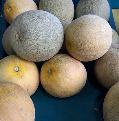 stacked yellow melons