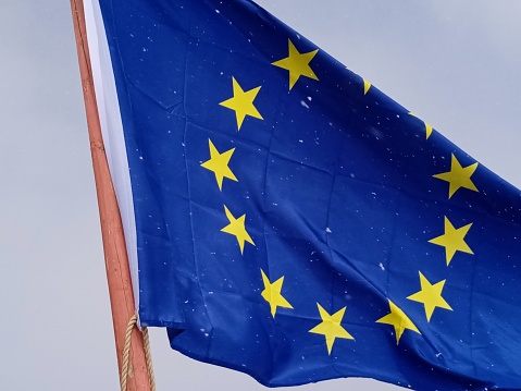 European Union flag, blue flag with yellow stars representing the EU