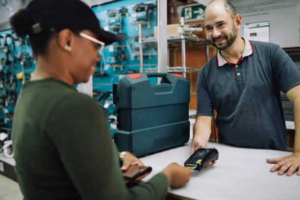 istock Customer paying for her hardware store purchase using a credit card 1770773022