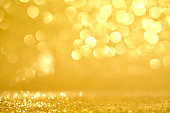 Golden bokeh lights on the Merry Christmas background.