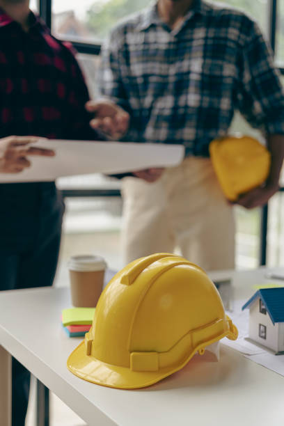 istock Meeting engineers or architects for projects where they work with partners and engineering tools to create on-site models and blueprints. construction concept 1770792411