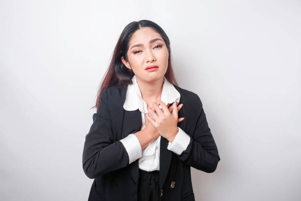 tired upset young business woman suffering from pain, muscle spasm at workplace. fatigue, deadline, pain and incorrect posture - physical injury backache occupation office imagens e fotografias de stock