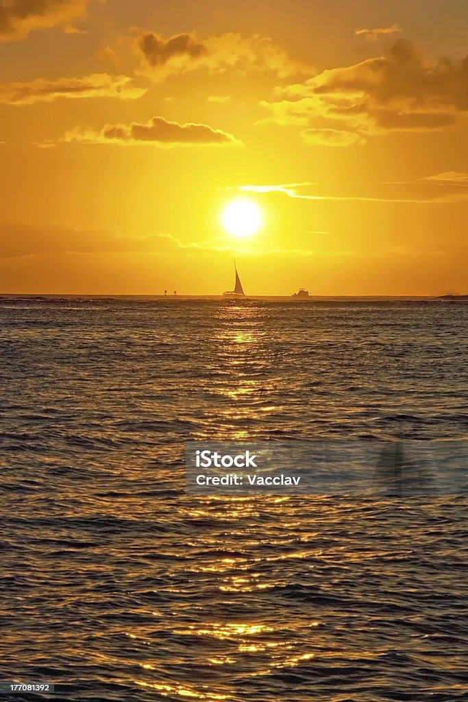 Beautiful sunset with boat on ocean Hawaii Backgrounds Stock Photo