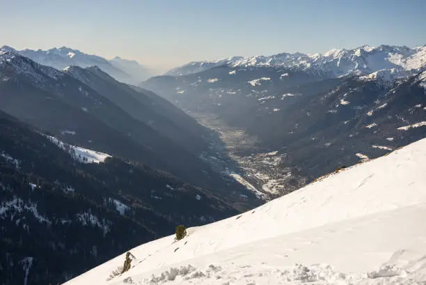 Photo of Winter view on dolomites alps in Italy.  Pinzolo in winter sunny day. Val Rendena dolomites  Italian alps, Trentino in Italy