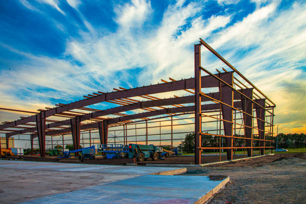 Triangular shapes of the solar park structure made of aluminum and galvanized steel at dusk and blue hour