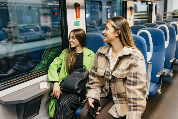 istock Two friends seating at train seat getting ready to take off 1770838236