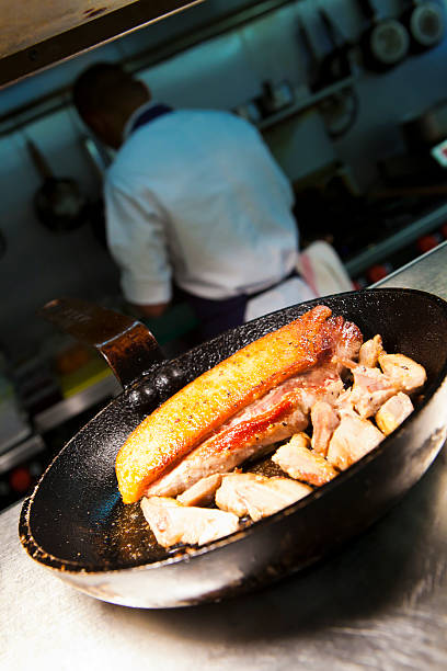 Close up shot of cooked pork on the hot plate